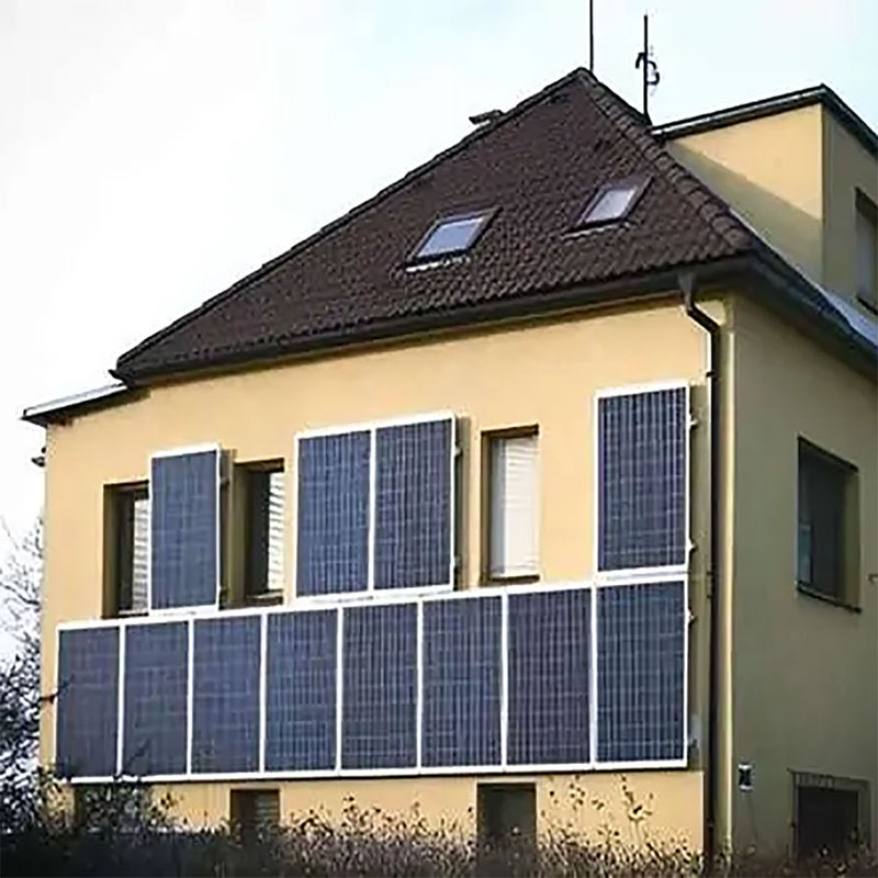 Residential facade with two rows of wall-mounted PV panels Residential facade with two rows of wall-mounted PV panels